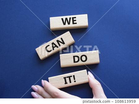 We can do it symbol. Concept words We can do it on wooden blocks. Beautiful deep blue background. Businessman hand. Business and We can do it concept. Copy space. We can do it symbol. Concept words We can do it on wooden blocks. Beautiful deep blue background. Businessman hand. Business and We can do it concept. Copy space. 108613959