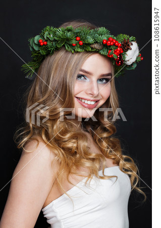 Glamorous happy positive female model with long blonde curly hair and makeup posing  108615947