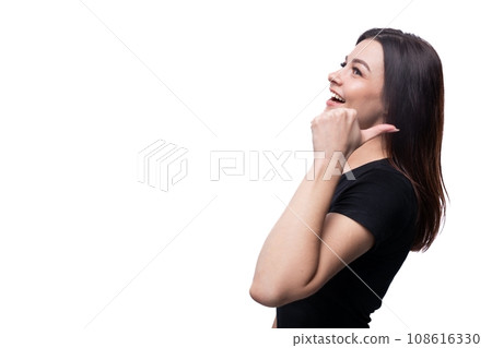 Caucasian young friendly brunette woman wearing a black t-shirt on a white background Caucasian young friendly brunette woman wearing a black t-shirt on a white background 108616330