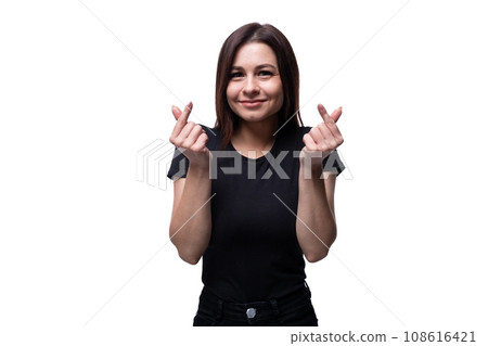 Attractive 25 year old woman showing heart gesture on white background. Sign language concept Attractive 25 year old woman showing heart gesture on white background. Sign language concept 108616421