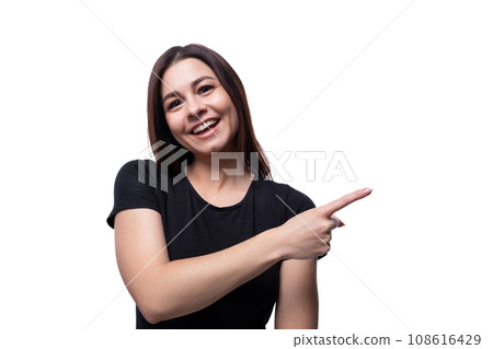 25 year old cute woman with straight black hair dressed in a black T-shirt gesturing 108616429
