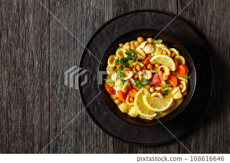orecchiette pasta chickpea soup in black bowl orecchiette pasta chickpea soup in black bowl 108616646