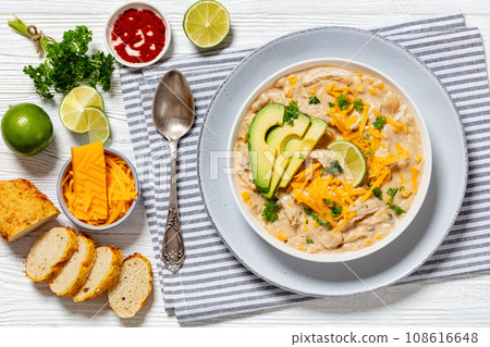 white chicken chili with cheese, avocado in bowl 108616648