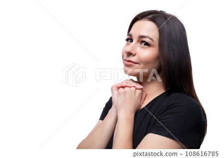 Young charming lady with brown eyes on a background with copy space Young charming lady with brown eyes on a background with copy space 108616785
