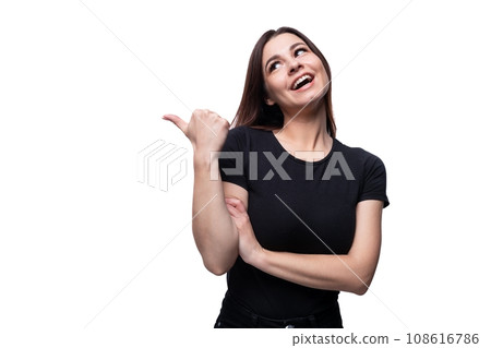 Young smiling european woman dressed in basic t-shirt pointing with finger Young smiling european woman dressed in basic t-shirt pointing with finger 108616786