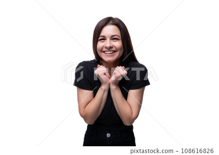 Portrait of young joyful cheerful brunette woman on studio white background 108616826