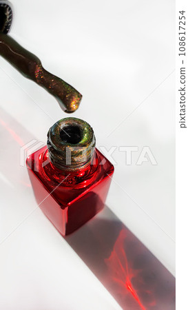 Jar with multi-colored nail polish. Choosing the color of manicure and gel polish. 108617254