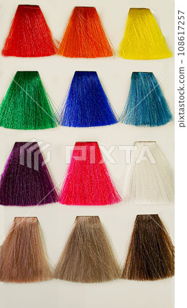 A palette of hair colors made from artificial strands on a white background. Color selection. A palette of hair colors made from artificial strands on a white background. Color selection. 108617257