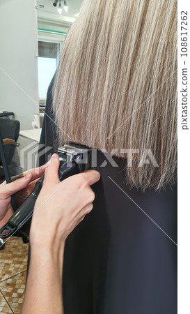 Hairstyle, curls and strands in a beauty salon. Long hair, beauty and health. Hairstyle, curls and strands in a beauty salon. Long hair, beauty and health. 108617262