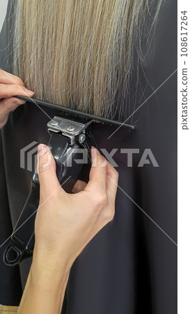 Hairstyle, curls and strands in a beauty salon. Long hair, beauty and health. 108617264