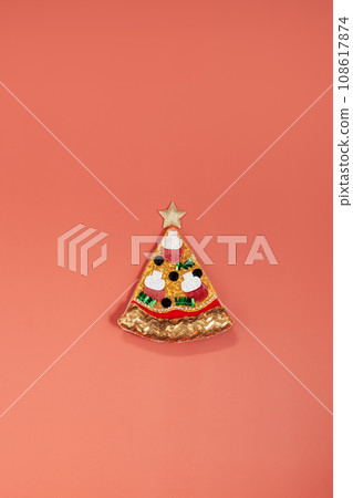 Merry Christmas food offers. Top view Artificial pizza slice and star decor on red background. Christmas background. Creative concept for seasonal and festive greetings for pizzeria delivery service Merry Christmas food offers. Top view Artificial pizza slice and star decor on red background. Christmas background. Creative concept for seasonal and festive greetings for pizzeria delivery service 108617874