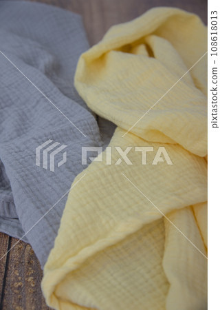 Soft colourful muslin blankets yellow and grey colours. Soft colourful muslin blankets yellow and grey colours. 108618013