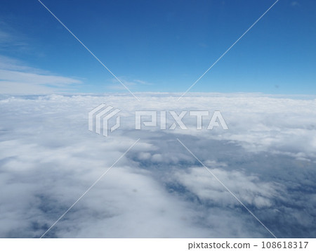 Sky and clouds taken from an airplane window Sky and clouds taken from an airplane window 108618317