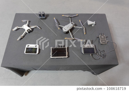 Array of metal components on a white table. 108618719