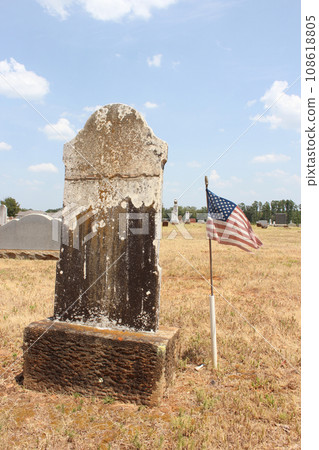 Old Headstone With American Flag in Rural East Texas Old Headstone With American Flag in Rural East Texas 108618805