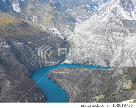 Breathtaking natural scenery of canyon, winding river of vivid turquoise, and mountain ranges. Natural background. 108619736