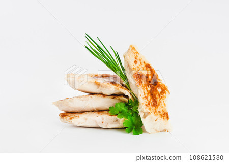 Fast food. Chicken fillets fried until half cooked, semi-finished product on a white background. Quick cooking at home. Copy space.Fast cooking.Fast homemade food. Fast food. Chicken fillets fried until half cooked, semi-finished product on a white background. Quick cooking at home. Copy space.Fast cooking.Fast homemade food. 108621580