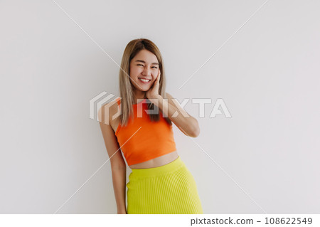 Portrait of happy cheerful woman in orange and lemon isolated on white. Portrait of happy cheerful woman in orange and lemon isolated on white. 108622549
