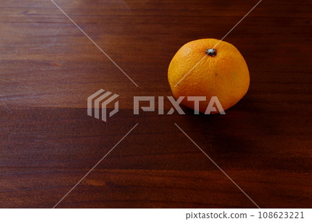 mandarin oranges placed on a wooden table mandarin oranges placed on a wooden table 108623221