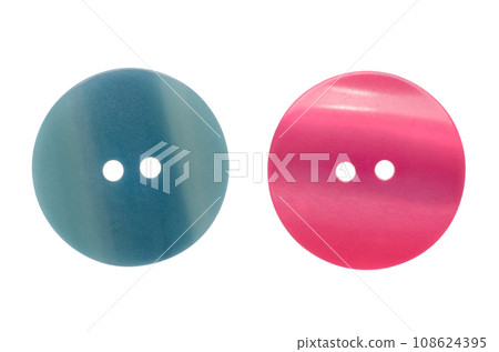 Two buttons lie on a white background 108624395