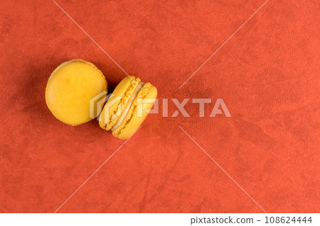 Two macaroons on red vinyl background 108624444