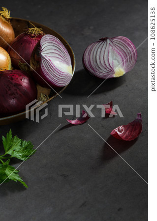 Fresh whole onions and parsley 108625138