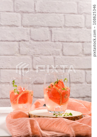 Grapefruit lemonade with thyme Grapefruit lemonade with thyme 108625346
