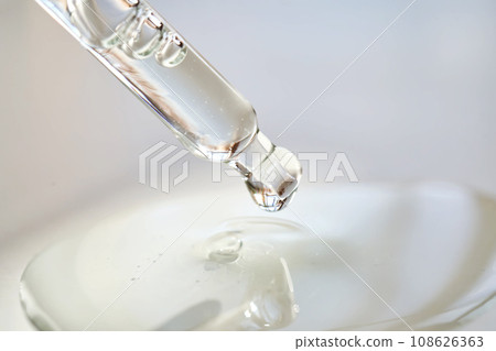 Pipette with perfume in a ray of sun. 108626363