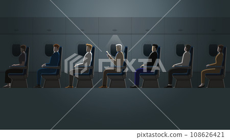 A senior white hair man is reading a book in a plane cabin alone in the dark A senior white hair man is reading a book in a plane cabin alone in the dark 108626421