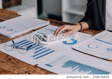 Business Documents, Auditor businesswoman checking searching document legal prepare paperwork or report for analysis TAX time,accountant Documents data contract partner deal in workplace office Business Documents, Auditor businesswoman checking searching document legal prepare paperwork or report for analysis TAX time,accountant Documents data contract partner deal in workplace office 108626605