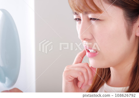 Young woman with tooth decay Young woman with tooth decay 108626792