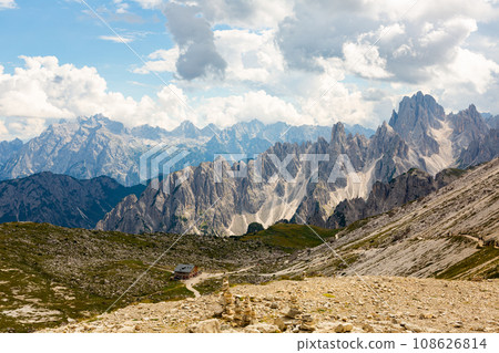 Wooden farm building on hillside in Dolomites. 108626814