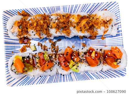 Popular Japanese dish is Uramaki rolls and Saketaki rolls Popular Japanese dish is Uramaki rolls and Saketaki rolls 108627090
