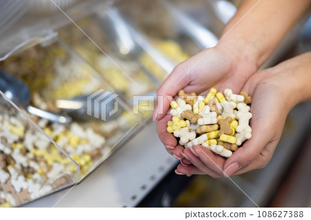 Assorted dry dog treats displayed in pet shop Assorted dry dog treats displayed in pet shop 108627388