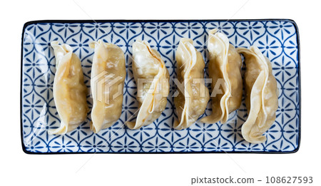 Steamed dumplings gyoza with meat filling served with sauce 108627593