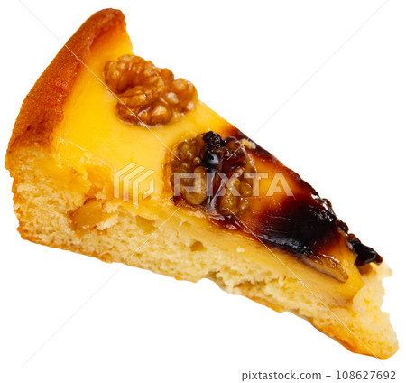 Piece of pie with walnuts served in a plate Piece of pie with walnuts served in a plate 108627692