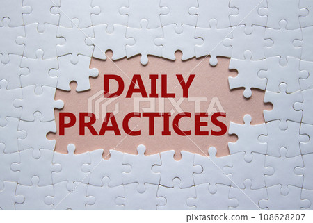 Daily Practices symbol. White puzzle with words Daily Practices. Beautiful pink background. Psychology and Daily Practices concept. Copy space. Daily Practices symbol. White puzzle with words Daily Practices. Beautiful pink background. Psychology and Daily Practices concept. Copy space. 108628207