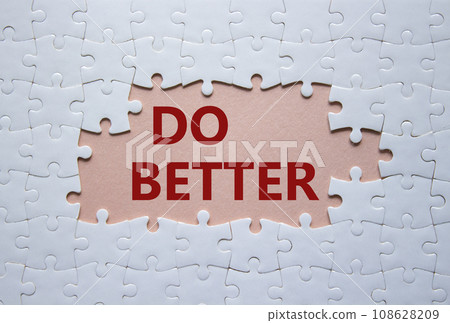 Do better symbol. White puzzle with words Do better. Beautiful pink background. Business and Do better concept. Copy space. 108628209