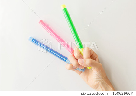 Hand holding three penlights Otaku Hand holding three penlights Otaku 108629667