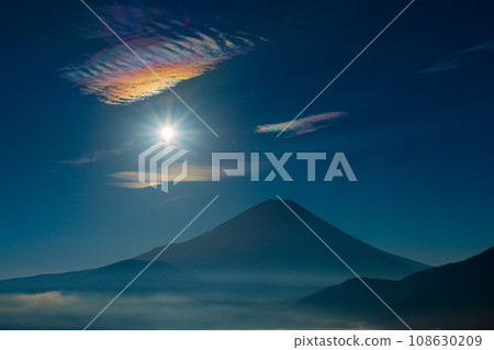 Mt. Fuji and the sun and clouds seen from Lake Motosu Mt. Fuji and the sun and clouds seen from Lake Motosu 108630209