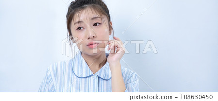 Image of a woman suffering from acne 108630450