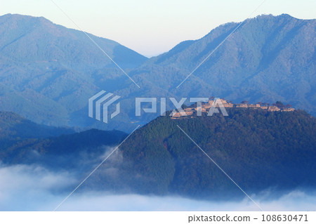 View of Takeda Castle ruins illuminated by the morning sun View of Takeda Castle ruins illuminated by the morning sun 108630471