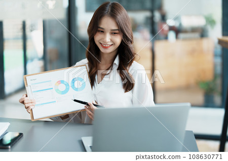 Business work and planning, portrait of a businesswoman using a computer in a meeting. Business work and planning, portrait of a businesswoman using a computer in a meeting. 108630771