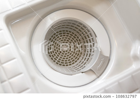 Image of a bathroom drain with the lid open 108632797