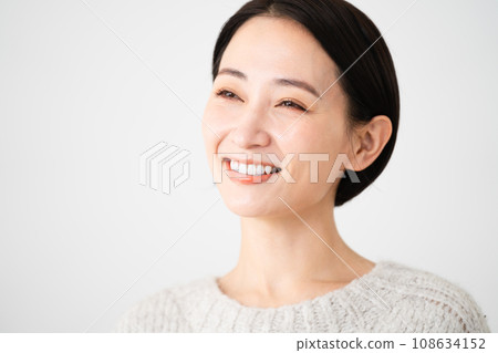 Young woman wearing knitwear lifestyle image Young woman wearing knitwear lifestyle image 108634152