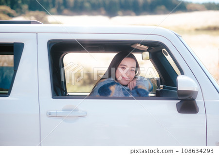 A woman driving in nature 108634293