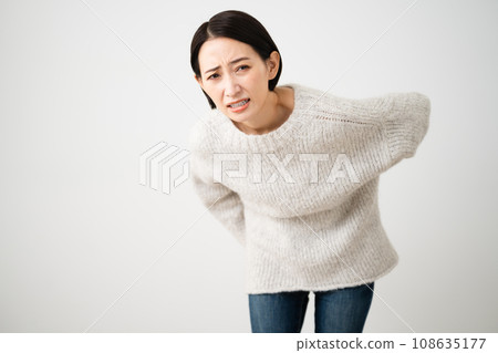 Young woman wearing knitwear lifestyle image 108635177