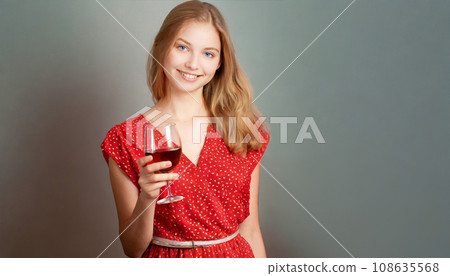 A woman holding a glass of wine A woman holding a glass of wine 108635568