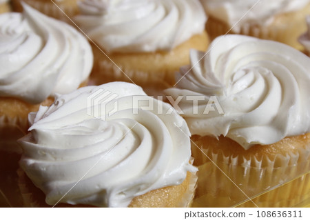 Cupcakes With White Icing on Table at Party or Event Cupcakes With White Icing on Table at Party or Event 108636311