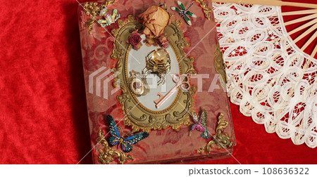 Antique Book With Colorful Gemstones and Mirror. Fairy Tale Romance Book Antique Book With Colorful Gemstones and Mirror. Fairy Tale Romance Book 108636322